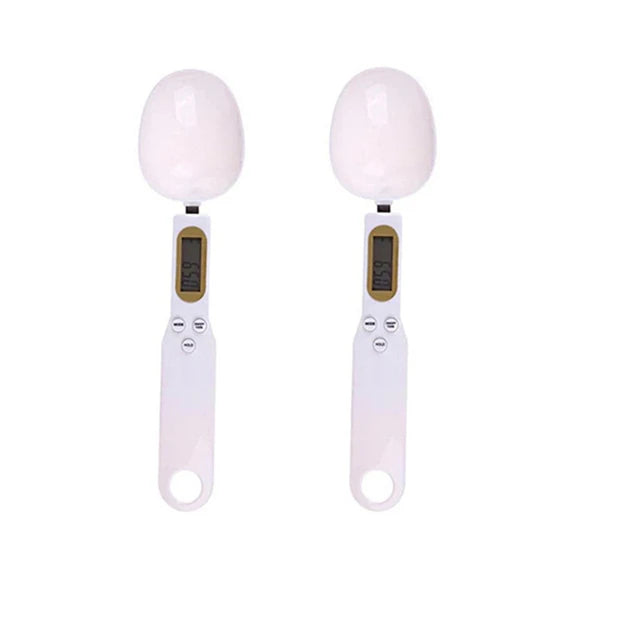 A pair of white precision digital kitchen scales for baking and measuring.