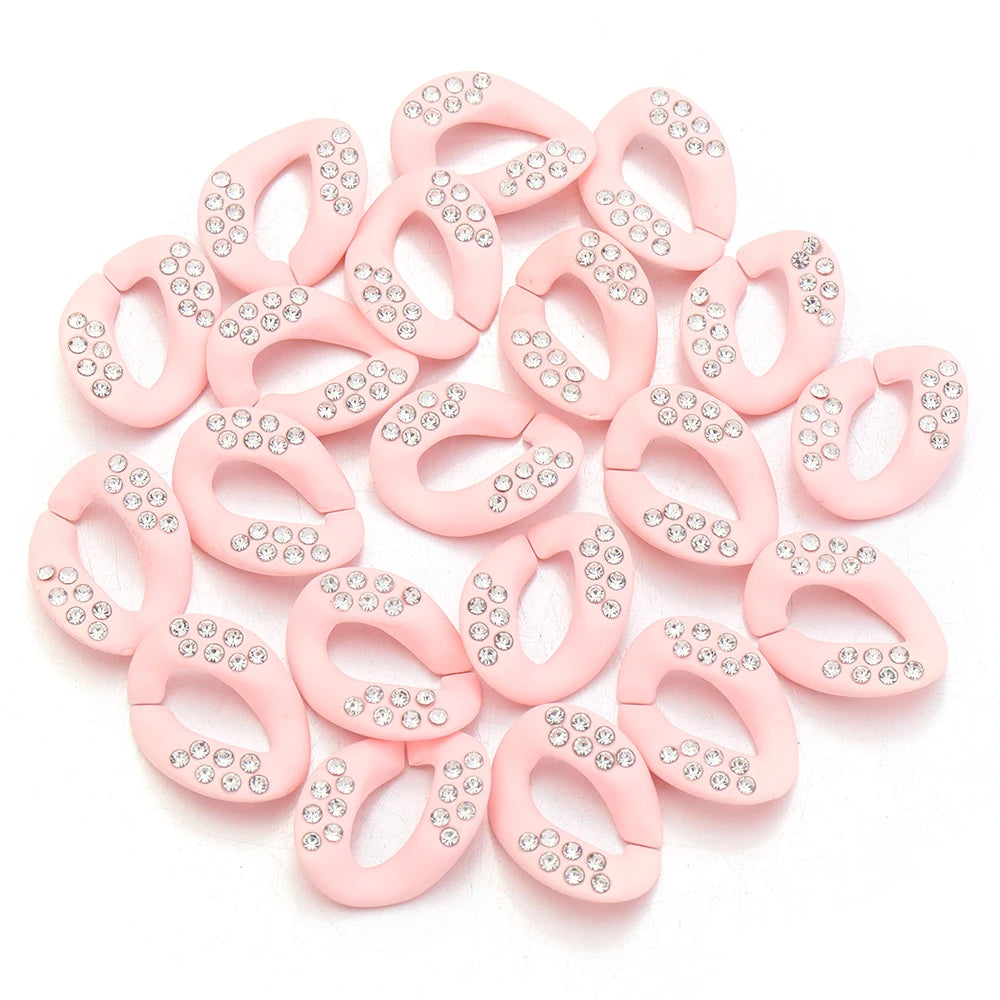 A collection of pink acrylic link chain connectors for DIY jewelry and bag making
