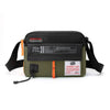 Olive green waterproof nylon crossbody bag with black strap and orange accents