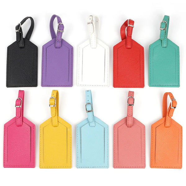 A collection of colorful PU leather luggage tags in various shades including purple, white, red, green, pink, and orange.