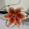 A realistic Phalaenopsis orchid flower shaped keychain with warm orange and brown tones.