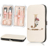 A beige cosmetic case featuring a large gold initial J and the word name, alongside an open kit of nail clippers and tools.