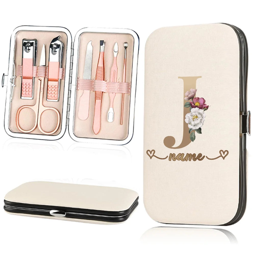 A beige cosmetic case featuring a large gold initial J and the word name, alongside an open kit of nail clippers and tools.