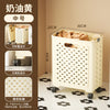 A white foldable laundry basket with a grid pattern and handles is shown on a floor, demonstrating its design features.