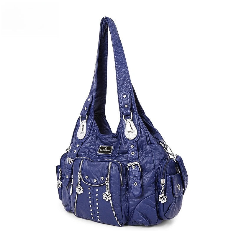 A dark blue vintage PU leather hobo shoulder bag with silver hardware and decorative floral embellishments.