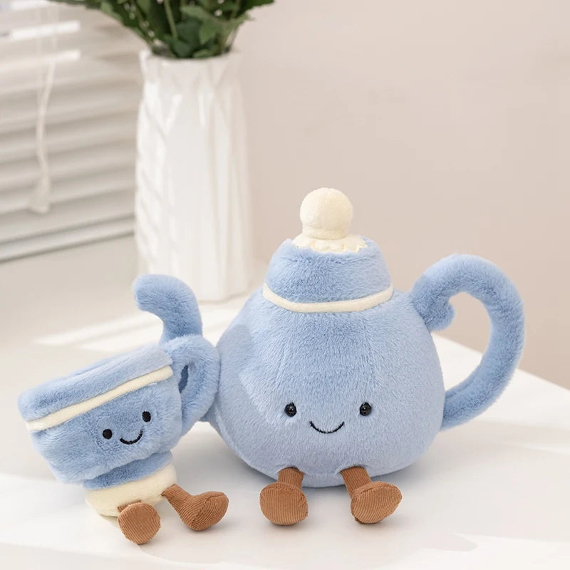 A soft blue cartoon character plush decor shaped like a teapot with a handle and small feet.