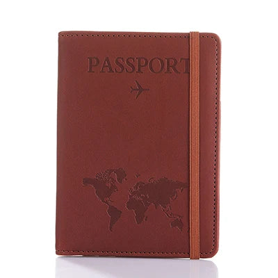 A brown leather passport organizer with embossed text and a world map design.