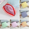 A collection of multi-functional storage pouches in various colors and striped patterns, including pink, yellow, blue, and gr