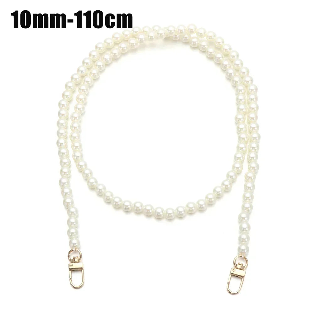 A strand of white pearls measuring 10mm to 110cm, used as a strap for a handbag or purse.