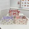 A collection of quilted cotton storage baskets featuring various floral and patterned designs.