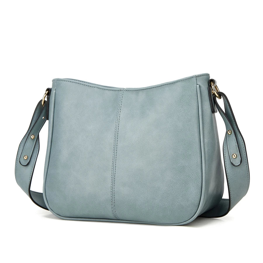 A light blue PU leather shoulder crossbody bag with a flap and gold hardware.