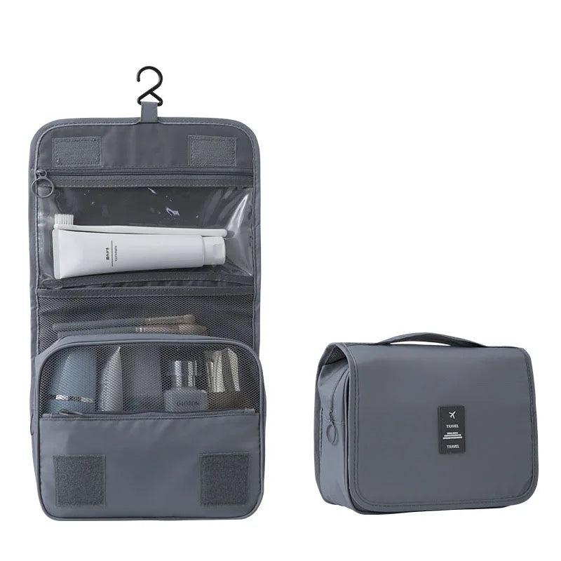 Graue tragbare Reise-Toiletten-Organizertasche mit mehreren Fächern und Tragegriff.