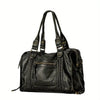 A black vintage washed leather tote bag with distressed detailing and leather handles.