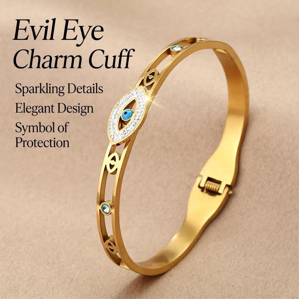 A gold evil eye charm cuff bracelet featuring a sparkling blue crystal design.