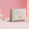 A light beige compact PU leather women's wallet with a zipper closure and floral embroidery on the front.