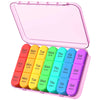 A pink weekly pill organizer with compartments for seven days of medication.