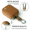 A brown leather metal buckle case with a zipper and attached keyring, showing its durable quality.