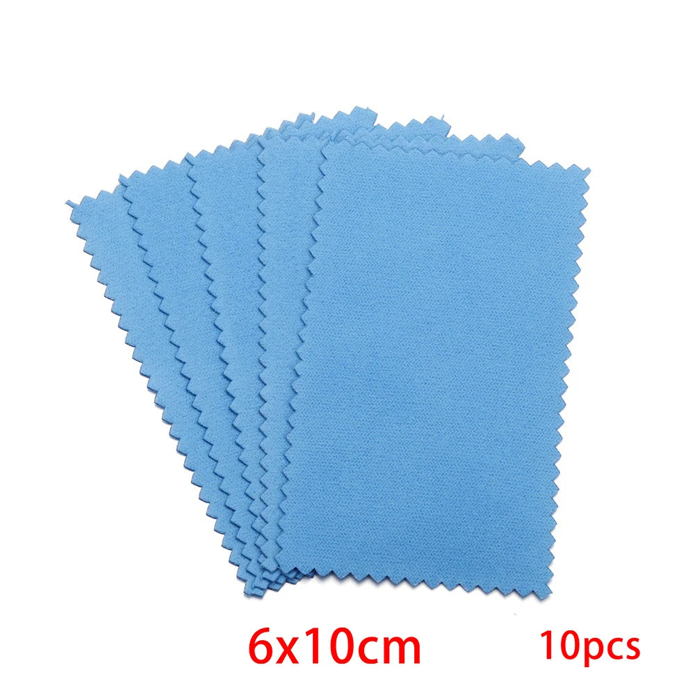 A stack of ten light blue polishing cloths with serrated edges.