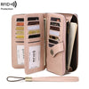 A light pink RFID protection multi-card wallet with a zipper and wrist strap is shown open.