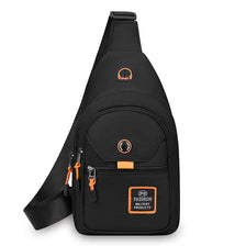Black compact oxford crossbody sling bag with orange accents and a sporty logo.