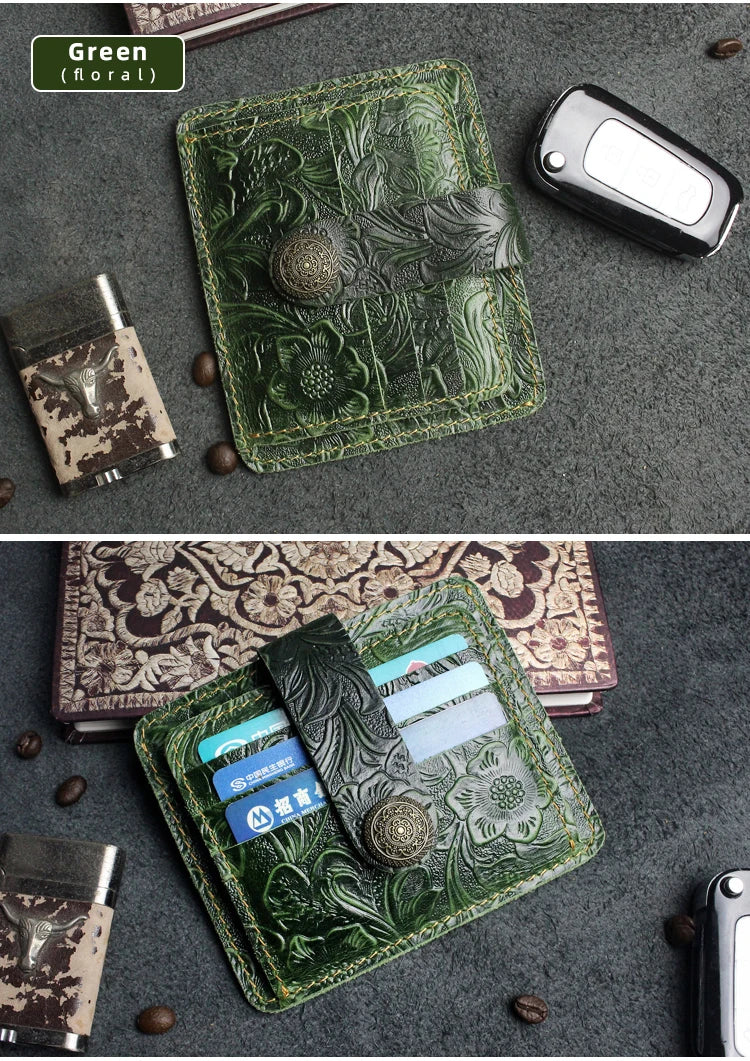 A green floral patterned genuine leather card wallet displayed on a dark gray surface with a black card visible.
