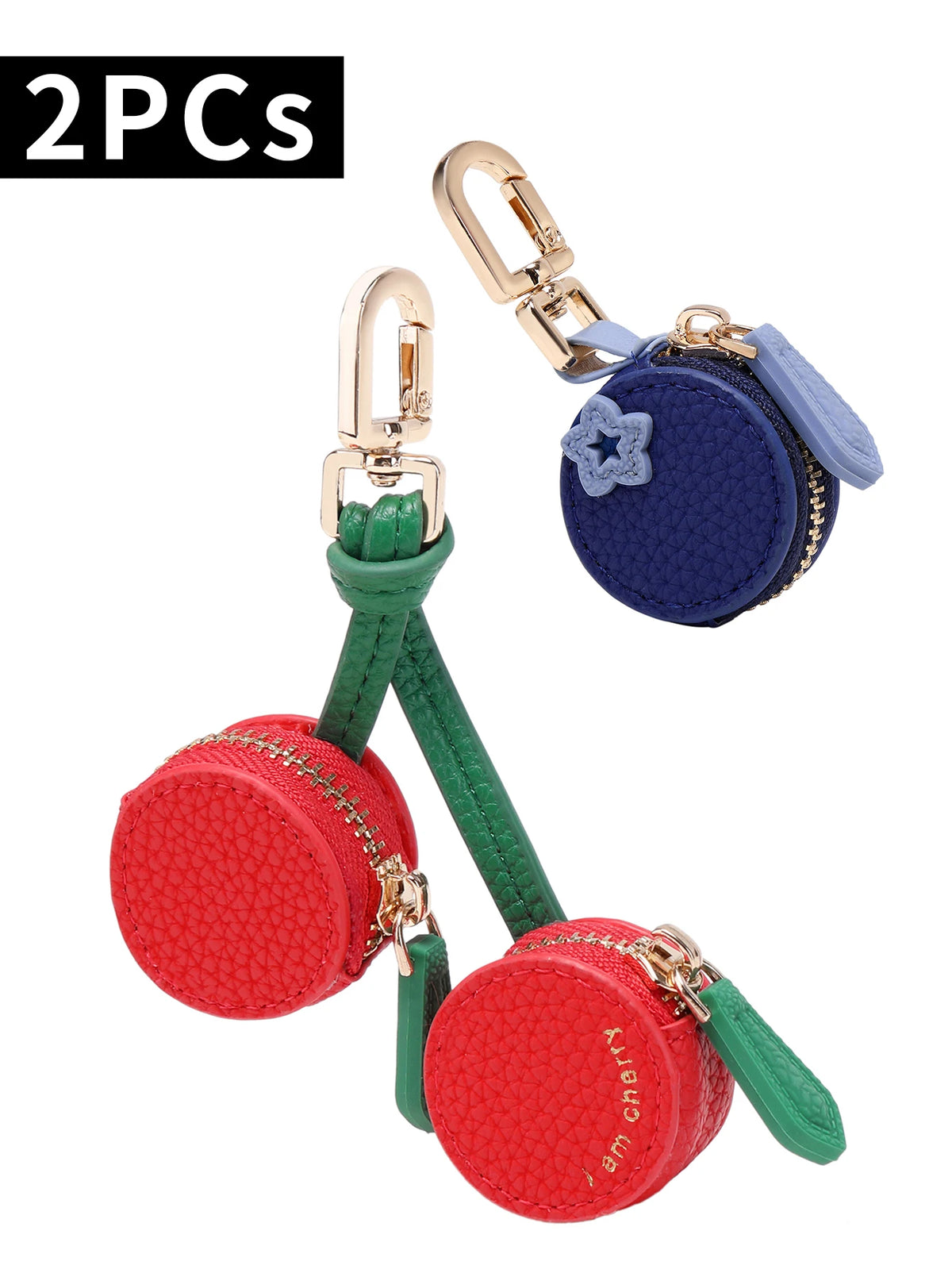 Two red cherry fruit shape coin purse keychains with gold hardware and blue fabric.