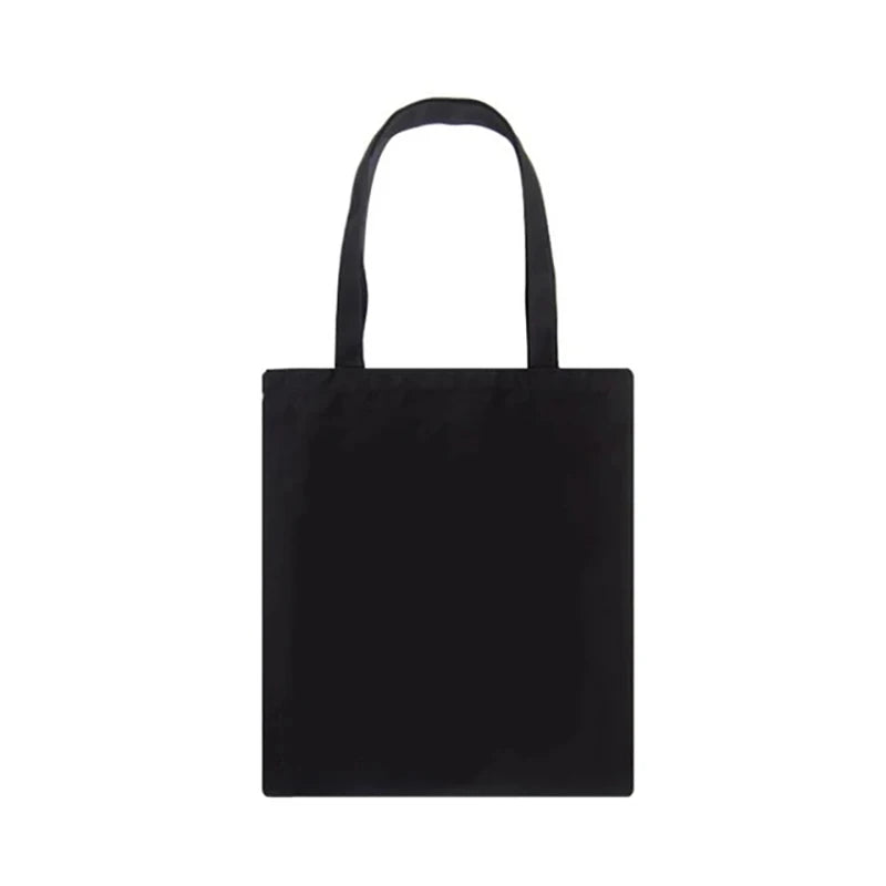 Sac de courses noir en toile avec poignée.