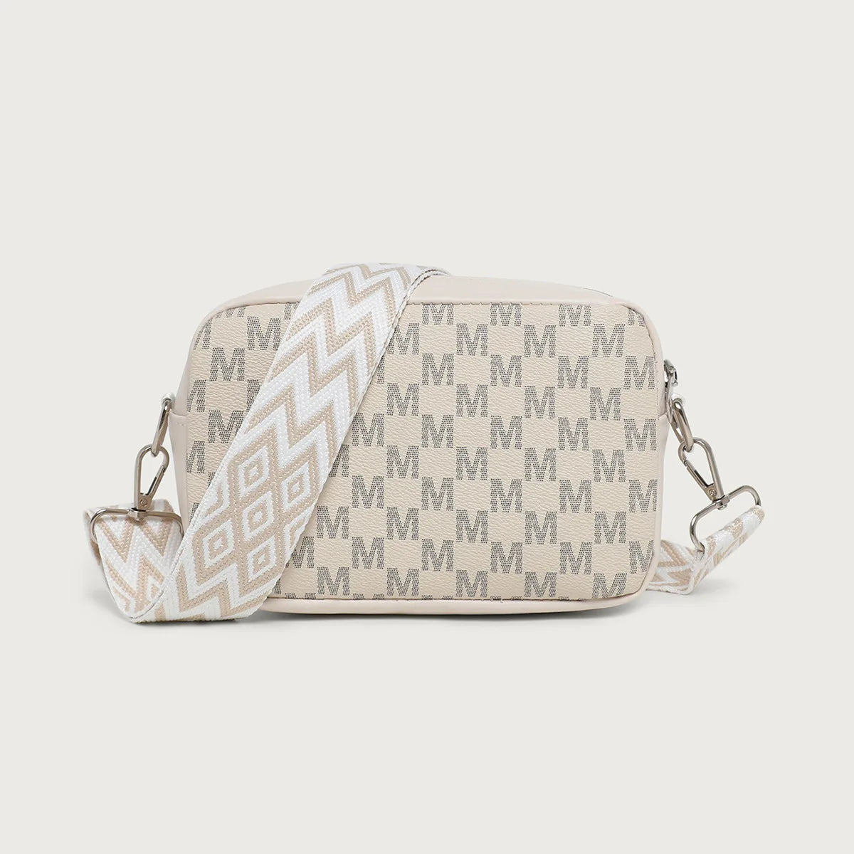 A beige crossbody bag with a chevron pattern and a matching strap.