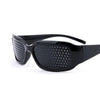 Black precision vision correction glasses with a dark frame and perforated lenses.
