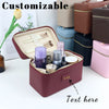 A customizable PU leather makeup bag in maroon color with compartments and tools displayed on a white surface.