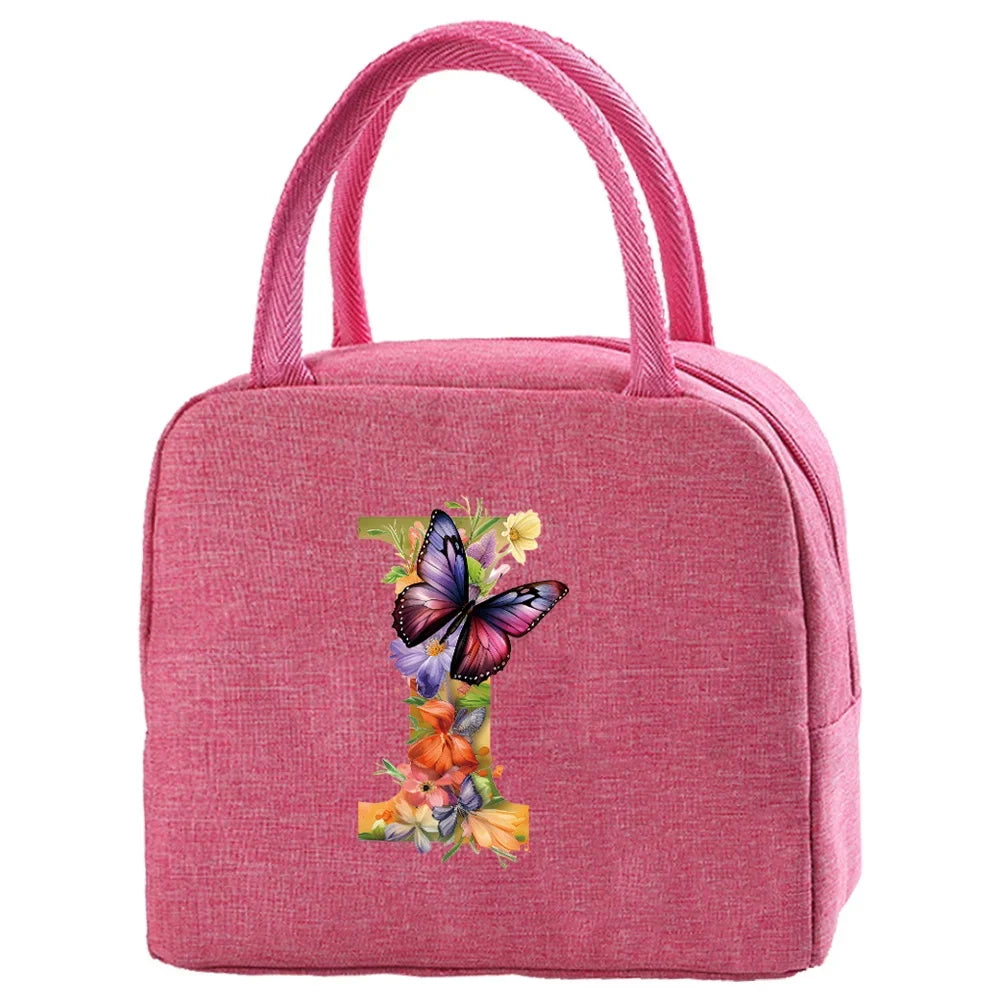 A pink insulated canvas lunch bag featuring a floral butterfly embroidery.