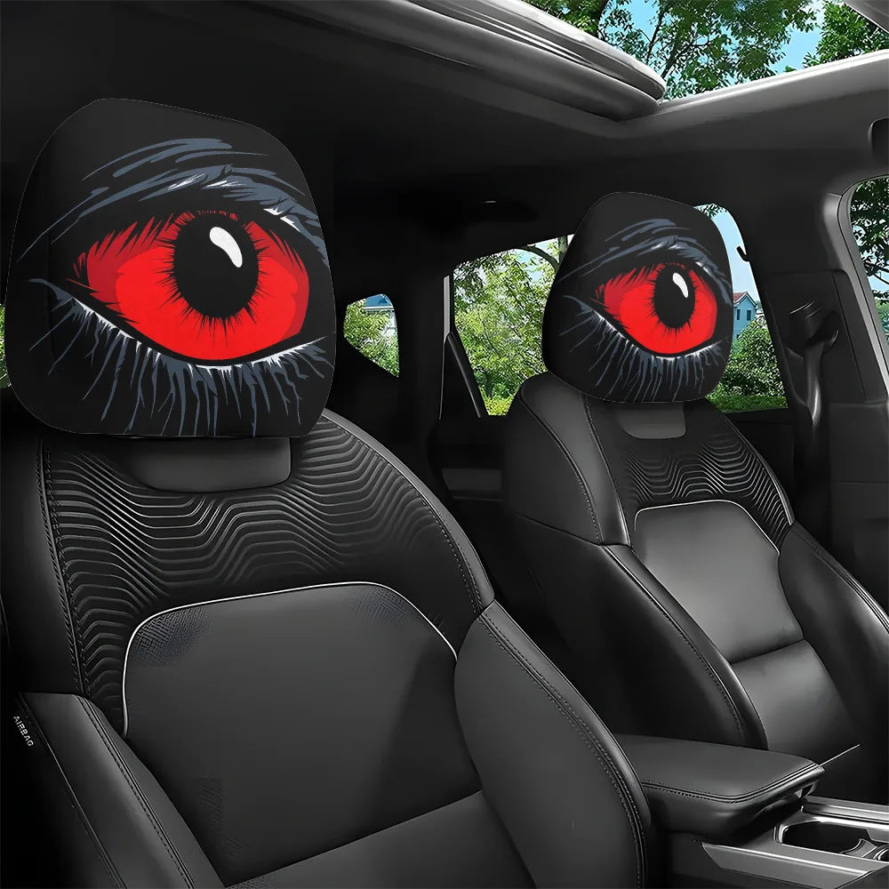 A pair of black car headrest covers featuring realistic red and black gothic devil eyes.