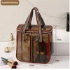 A clear waterproof toiletry bag with brown and black accents is shown next to various grooming tools.