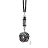 A pendant featuring an alloy wheel hub brake disc and rearview mirror design.