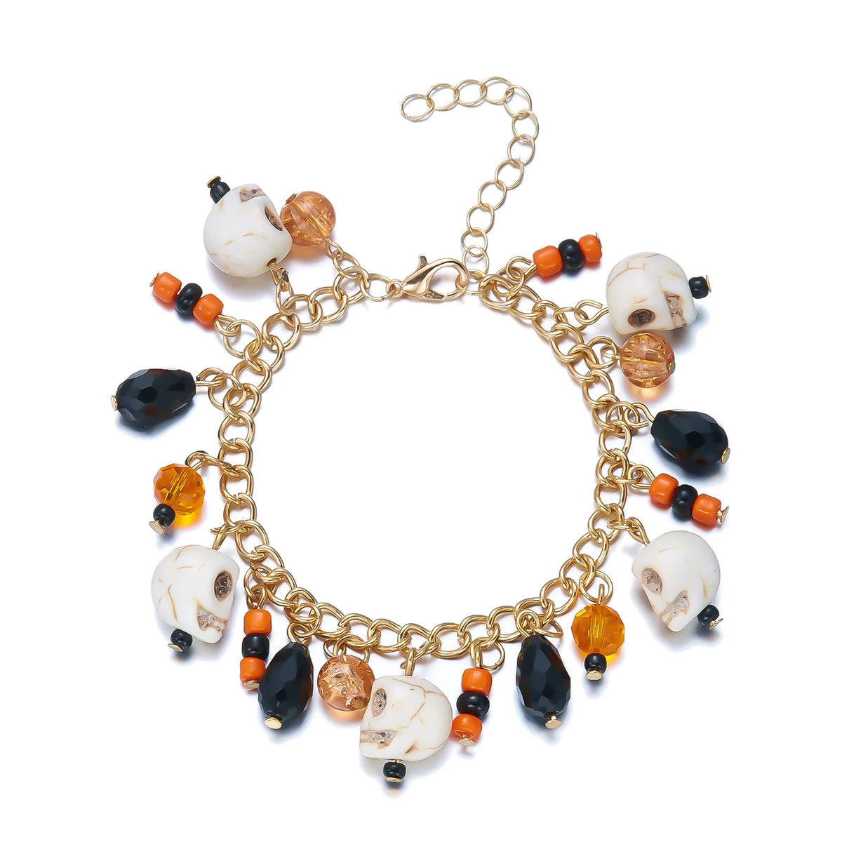 A gold charm bracelet featuring white and black pumpkin ghost charms.