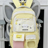 A yellow and white Manbuzhe backpack hanging on a white coat rack.
