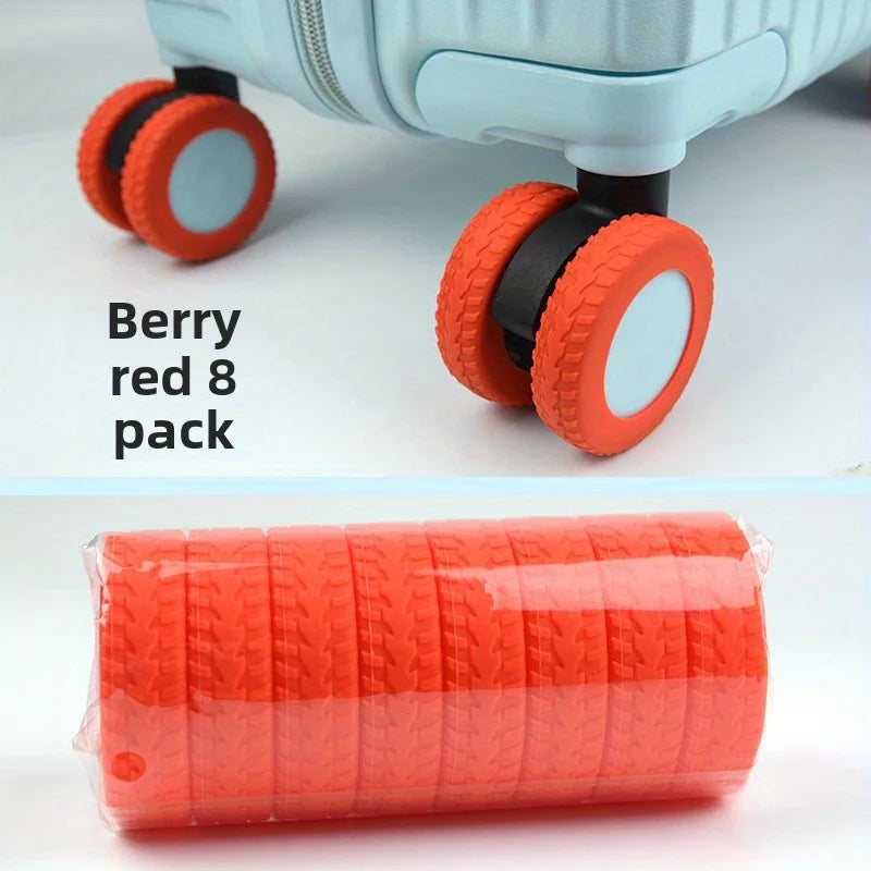 A set of eight orange travel luggage wheel protectors, some attached to a light blue suitcase.