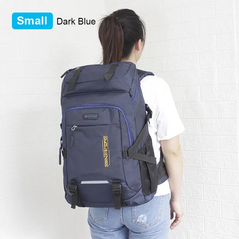 A dark blue large capacity travel backpack with a rain cover is shown from the back.