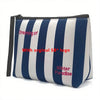 Bolsa cosmética a rayas azul marino y blanco con el logo original SB y Winter Paradise impresos.