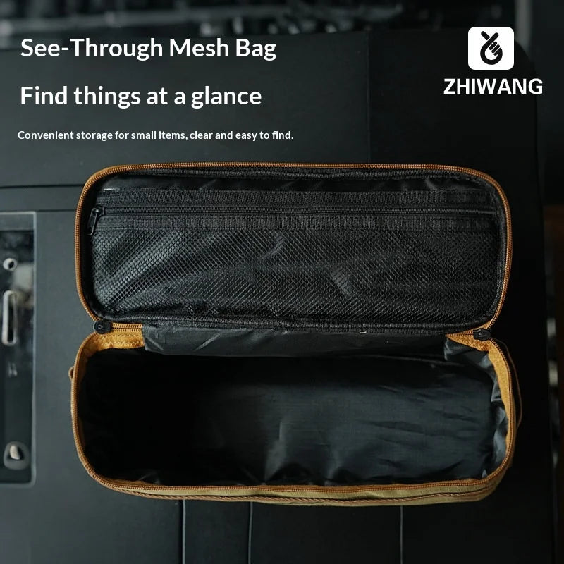 A black see-through mesh bag with a tan lining is shown open, displaying organized storage for small items.