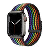 Apple Watch with a multi-colored braided stretch band worn on the wrist.