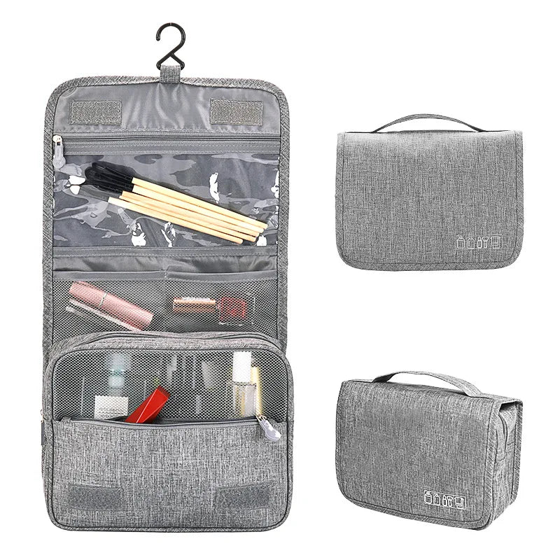 Sac organisateur portable en tissu gris avec plusieurs compartiments et une poignée.