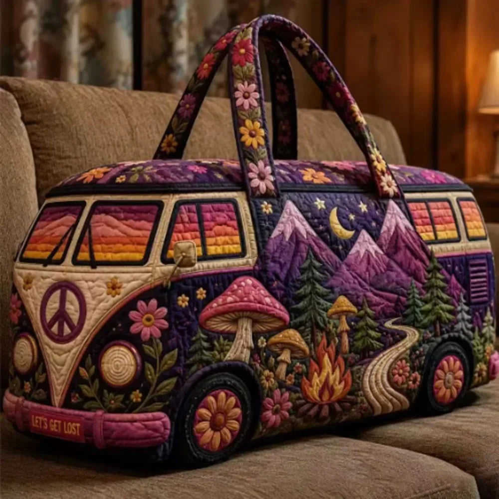 A purple and pink quilted travel duffle bag decorated with peace signs, mushrooms, and forest scenes.