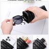 A black quilted PU leather multi-functional case being held, demonstrating its use for glasses, lipstick, and keys.