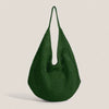 A dark green crochet shoulder bag with a mesh detailing, shown against a light background.