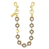 Gold-toned crystal petal keychain with rhinestone charm hanging from a split ring.