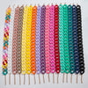 A display of colorful matte acrylic choker necklaces in various shades including pink, purple, orange, yellow, and green.