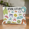 A white zippered pouch filled with various hair accessories like scrunchies and clips.