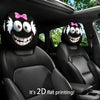 Two black headrest covers with white fur and pink bows are installed in a car seat interior.