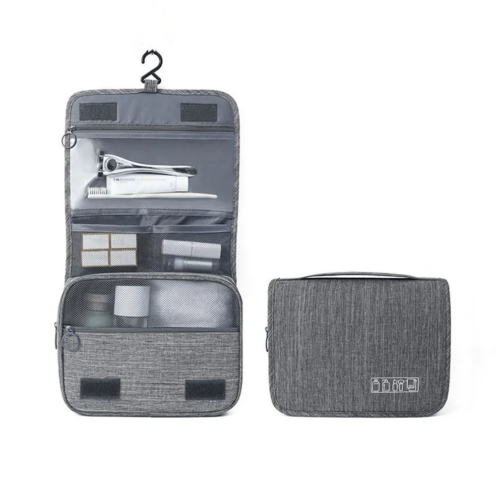A gray portable waterproof toiletry washbag with a hanging hook, shown open and closed.